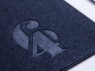 Sophisticated black and silver packaging with embossed logo